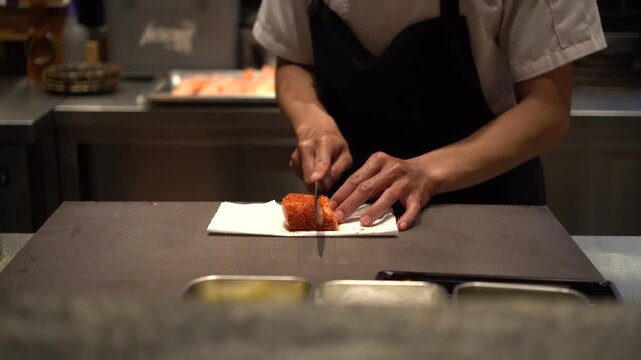 Japanese chef making a sushi