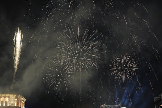 Spectacular Gold Fireworks Display with Smoke and Digital Noise at Night Celebration (Grainy Texture, Republic Square in Yerevan, Armenia)