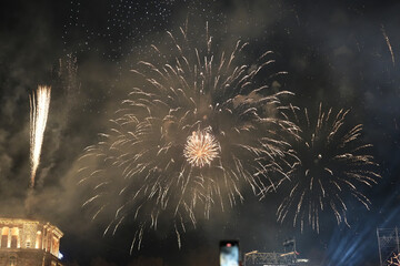 Spectacular Gold Fireworks Display with Smoke and Digital Noise at Night Celebration (Grainy Texture, Republic Square in Yerevan, Armenia)