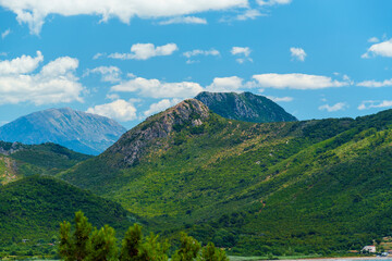 Fototapeta premium beautiful landscape with a view of the mountains covered with forest on a bright sunny day