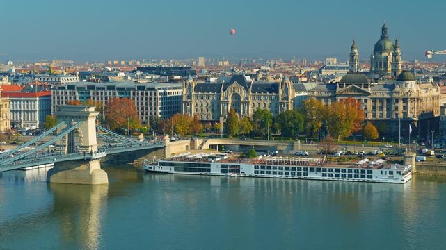 Panoramic view of Budapest and Danube River, city architecture, bridges and road traffic