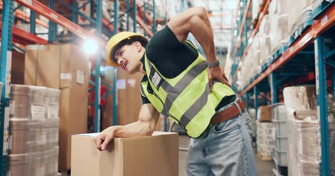 Logistics, back pain or man in depot with accident, spine massage or emergency in supply chain. Ache, flare or loader in warehouse with injury, muscle strain or osteoarthritis in distribution.