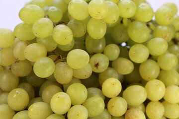 A Full Frame Close Up Of Tight Green Grapes. The Image Highlights The Smooth Skin And Freshness Of The Fruit Cluster, Perfect For Food Backgrounds.