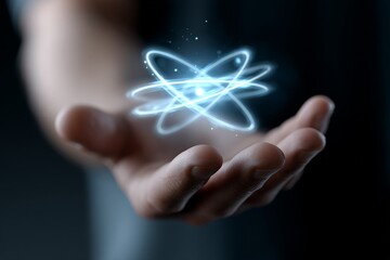 Hand holding glowing atom symbolizing science and energy exploration