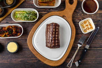 Juicy grilled beef steak served on a rustic wooden platter