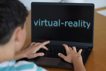 Virtual Reality. Children, teenagers, and technology. Preteen writing words on their laptop screen