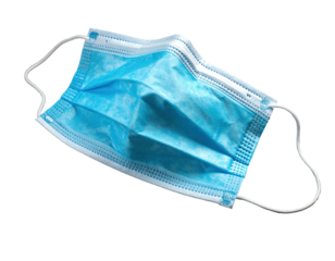 A blue, pleated surgical mask with white ear loops against black