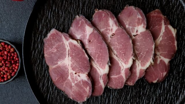 Meat, smoked ham, or pork sausage sliced for breakfast sandwiches. Sliced ham as a food background for your design