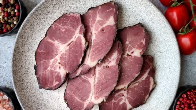 Meat, smoked ham, or pork sausage sliced for breakfast sandwiches. Sliced ham as a food background for your design
