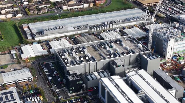 Aerial video of a modern data center in Slough, United Kingdom, computing infrastructure, storage servers, digital systems that process and large volumes of data for cloud and enterprise services.