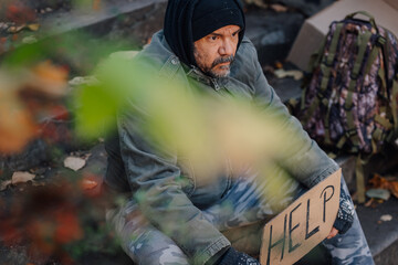 Homeless man begging on street for help and support