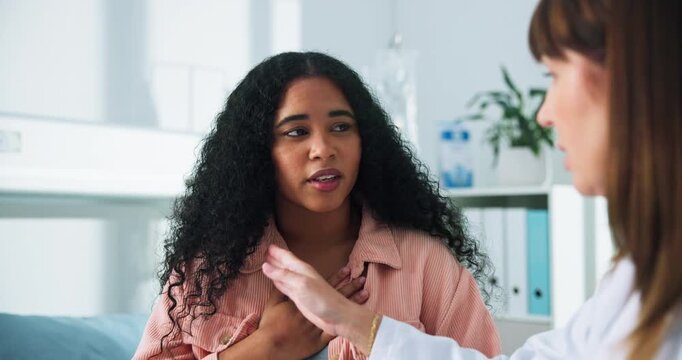 Tablet, doctor and talking with woman and heartburn in hospital for gerd diagnosis, advice or acid reflux checkup. Medical, digital report and ent assessment with people for symptoms history