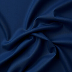 Obraz premium Dark navy blue silk satin fabric texture background, elegant midnight blue cloth