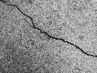 Fototapeta premium Crack wall texture background broken earthquake effect, whtie grey building cement damage pattern plaster grunge black line paint surface abstract, construction rough street concrete backdrop.