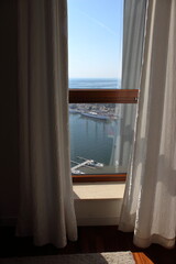 Sea view marina seen through hotel window