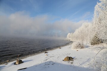 Frosty Trees Line a Snowy Shore on a Clear Winter Day in Lac-Megantic, Quebec, Canada