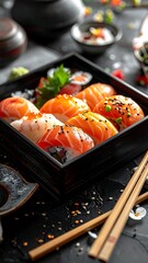 Close-up of sushi arrangement in wooden box, with chopsticks