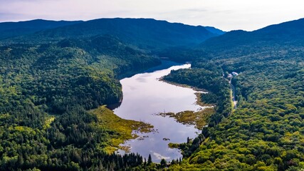 Aerial View from Mount Belanger, Quebec, Canada of a Serene Lake Surrounded by Lush Green Forests in the Mountains