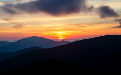 View from Mount Gosford, Quebec, Canada of Silhouetted Mountains Against a Vibrant Sunrise