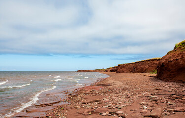 Red Sand Beach and Cliffs on a Cloudy Day in Prince Edward Island