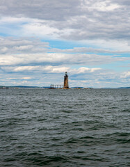 A Distant View of the Ram Island Ledge Light Station on a Cloudy Day