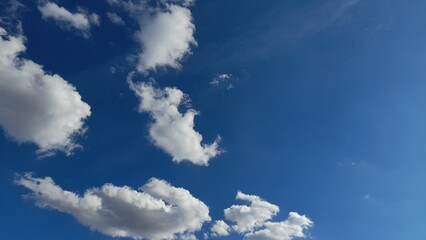 Beautiful deep blue sky with white clouds on a sunny day