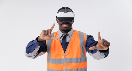 African male adult in construction vest exploring virtual reality technology, touching immersive display