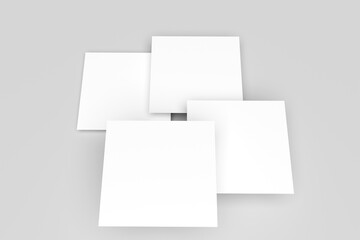 Blank white square paper mockups or square card isolated on a gray background.