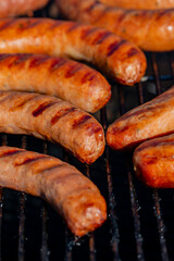 Close-Up of Grilled Sausages on a Charcoal Grill