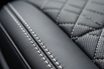 Luxury car seat interior with perforated leather and stitching details