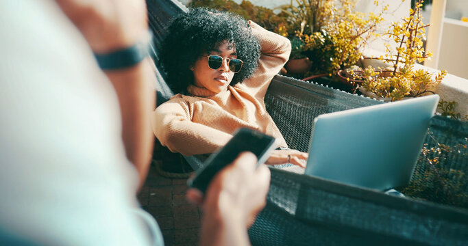 Couple, outdoor and woman on hammock with laptop, scroll or remote work on website, relax and online. Chill, freelancer and partner with smartphone for chat on social media, home and browsing on app - Powered by Adobe