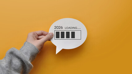 2026 download concept with a speech balloon on a yellow background