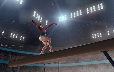 A gymnast performs a difficult trick on a balance beam.