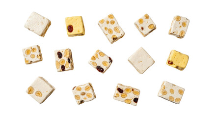 Top view of scattered gourmet white nougat pieces with almonds, pistachios, and dried fruit on a transparent background