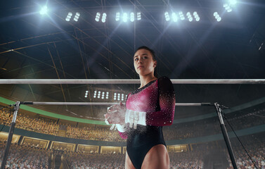 A gymnast performs a difficult trick on a horizontal bar.