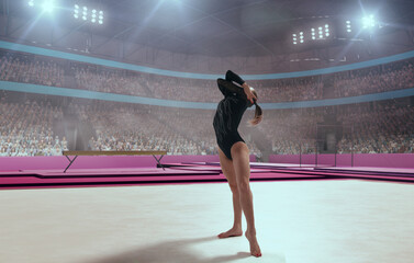 Female gymnast on professional gymnasts arena.