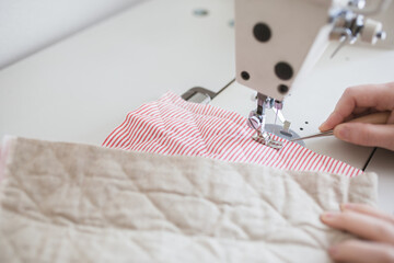 Sewing Fabric with a Sewing Machine © hyonhyoro