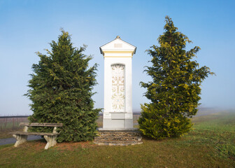 religious statue at village of Ritzing with fog