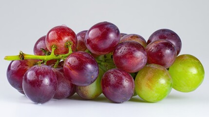 Obraz premium cluster of Muscat grapes on a clean white background, glossy purple and green grapes, detailed skin, clear stems