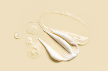 samples of cosmetic care products smear of cream gel texture, pastel background