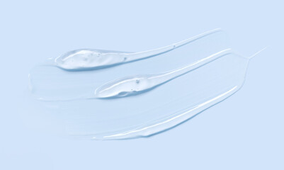 cosmetic texture gel essence smear on a blue background close-up