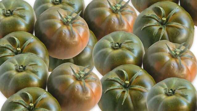 Kumato tomatoes forming a healthy dark vegetable background
