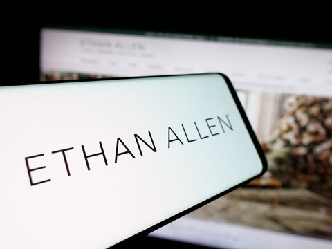 Stuttgart, Germany - 12-10-2025: Smartphone with logo of furnishing company Ethan Allen Interiors Inc. on screen in front of website. Focus on center-left of phone display.