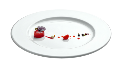 A close-up showcases an elegant presentation on a white plate. A small, vibrant tomato, accented with a delicate flower, is artfully arranged. A single slice and dots
