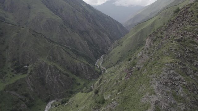 Stunning scenery of the ancient stone mountain village of Mutso in the Khevsureti region of Georgia, featuring dramatic architecture set within a rugged alpine landscape