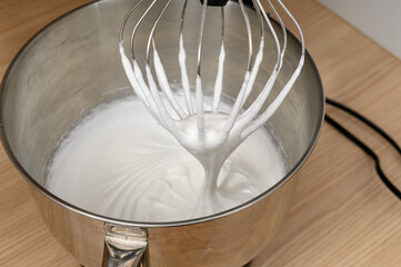 Egg whites beaten stiff in a food processor