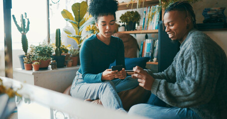 African couple, credit card and phone in home for online shopping, smile or financial freedom in lounge. People, smartphone and customer experience for ecommerce, easy payment or fintech app in house © Ruansan/peopleimages.com