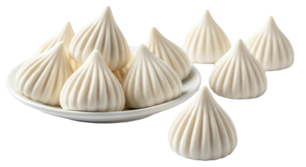 Traditional handmade white modaks on a minimalist ceramic plate