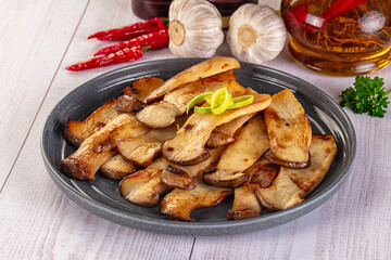 Roasted eringi mushrooms in the plate