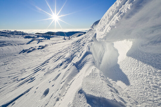 View of dazzling sunlight illuminates the snow-covered landscape, a pristine vista of winter's embrace, Kosarisko, Banska Bystrica region, Slovakia.